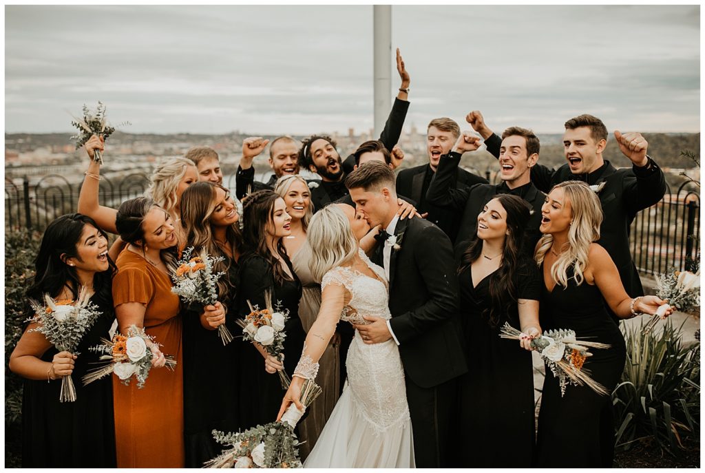 bridal party celebrating with bride and groom