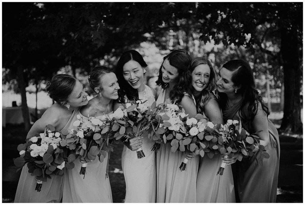 bride and bridesmaids portraits on wedding day at the marmalade lily venue