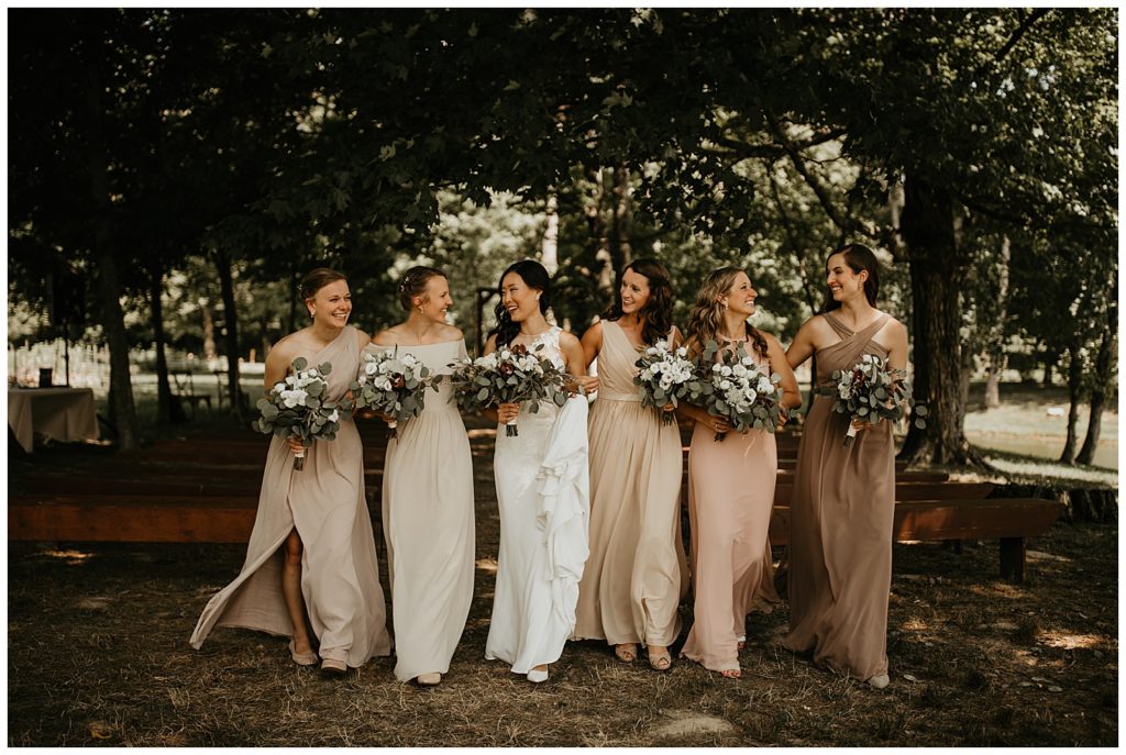 bride and bridesmaids portraits on wedding day at the marmalade lily venue