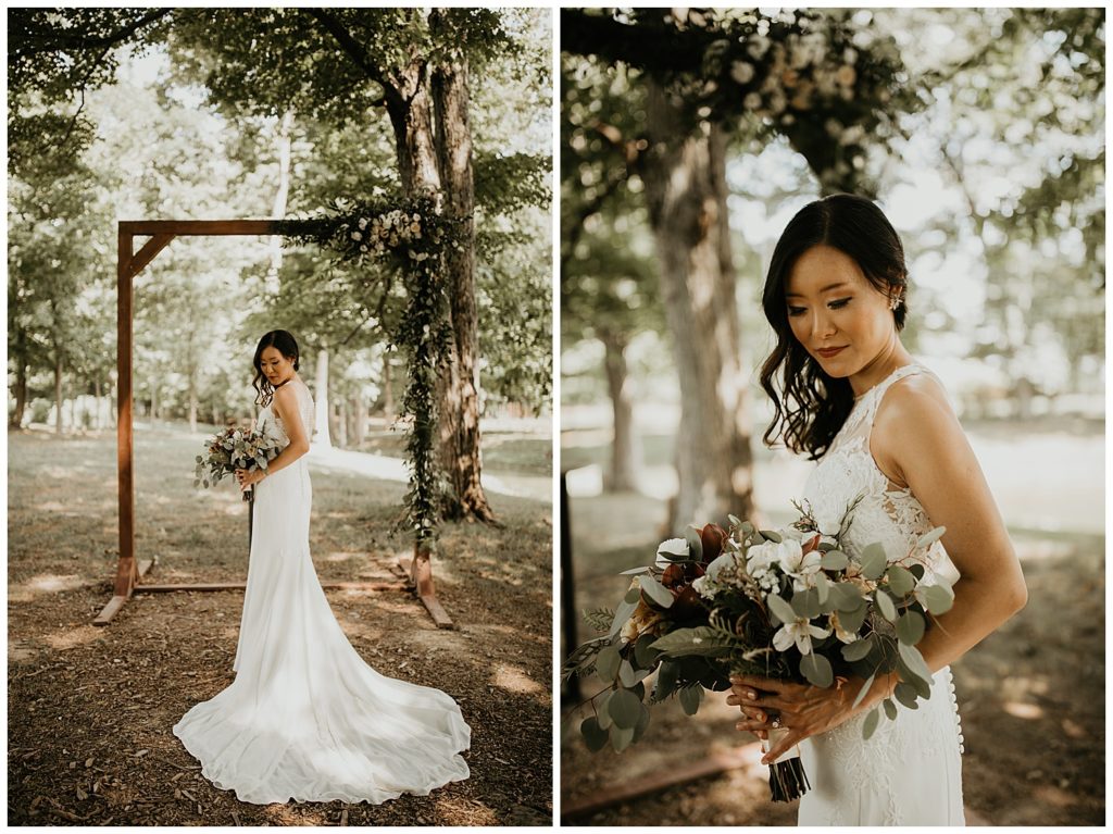 bride in wedding gown holding bouquet with neutral colored roses and eucalyptus