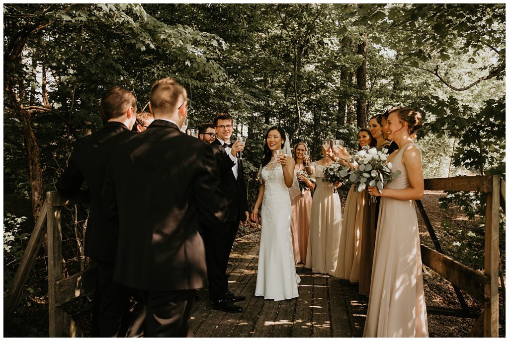 bride and groom wedding ceremony in the woods at the marmalade lily venue