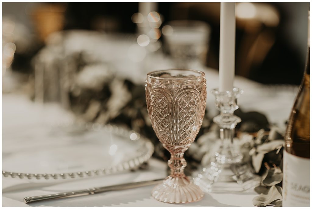 wedding reception at the marmalade lily in loveland ohio. tables with silver dollar eucalyptus greenery garland