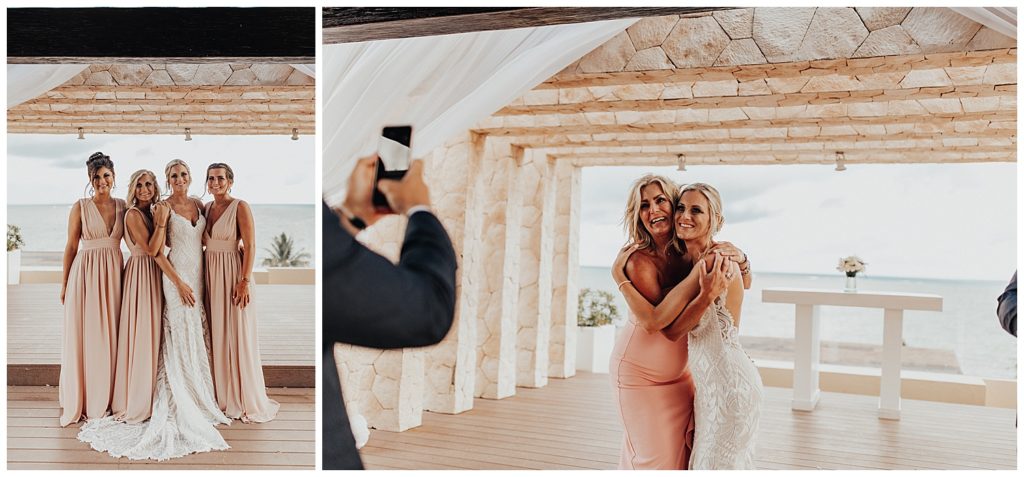 bridal party taking photos on the beach before wedding ceremony in cancun mexico