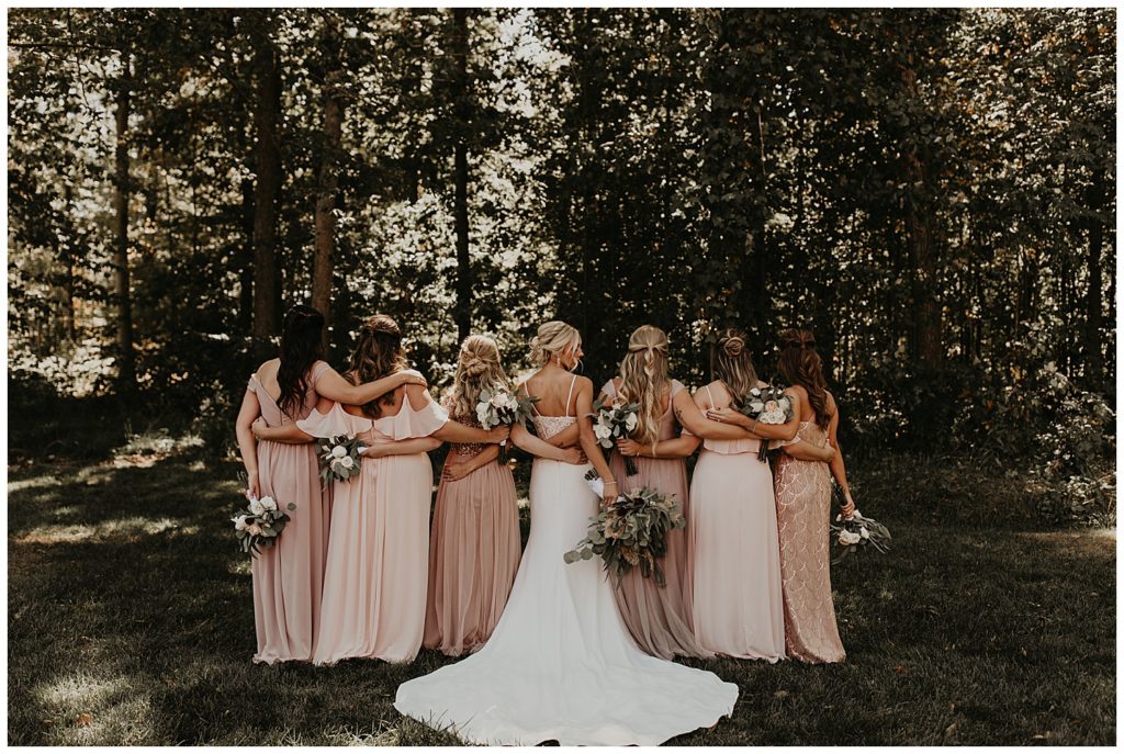 bridesmaids wearing long blush dresses 